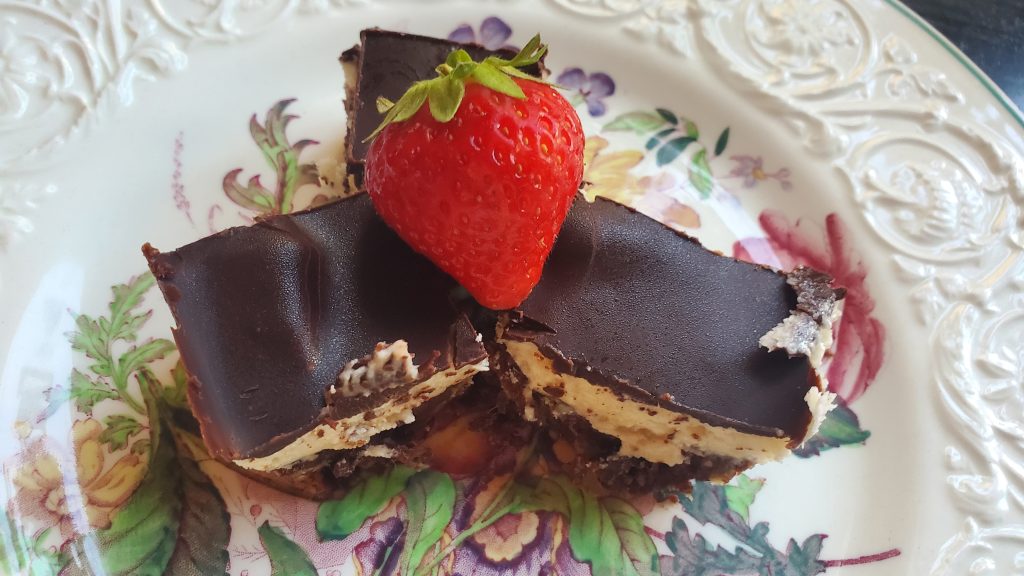 Nanaimo Bars with a Strawberry 