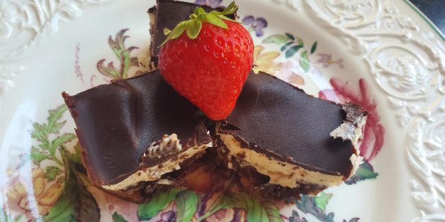 Nanaimo Bars with a Strawberry