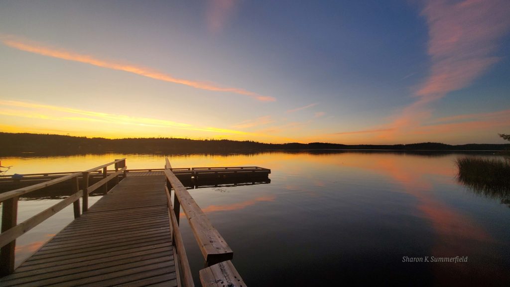 Photography by Sharon K. Summerfield.  Sunset at Ten Mil Lake outside of Quesnel